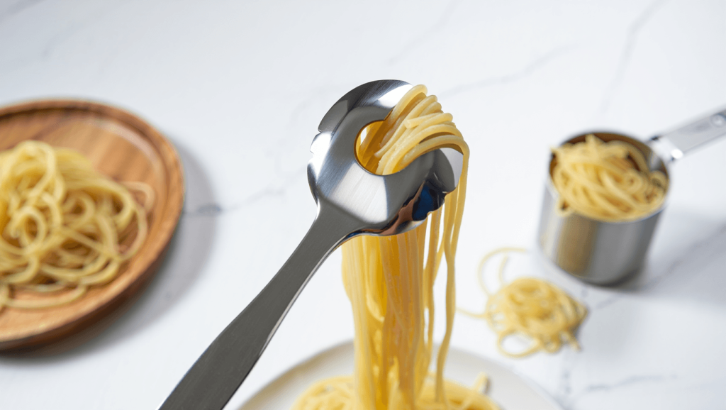 Spaghetti spatula in hands isolated on white background isolation